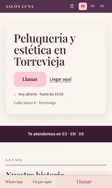 La página de inicio de una peluquería vista en un móvil: el nombre, el botón para llamar, la dirección y los idiomas en los que atienden.